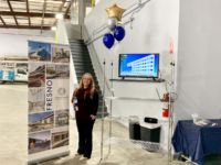 Anna Greer, Fresno-based estimator, stands proudly beside some of the regional projects she has helped to complete. Anna Greer, Giroux Glass, Inc.